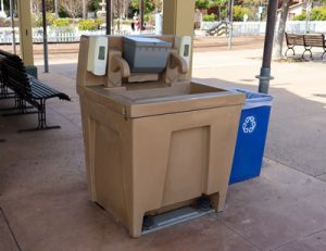 brown hand washing station under a buildings awning